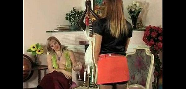  MILF rides on lesbian with strapon